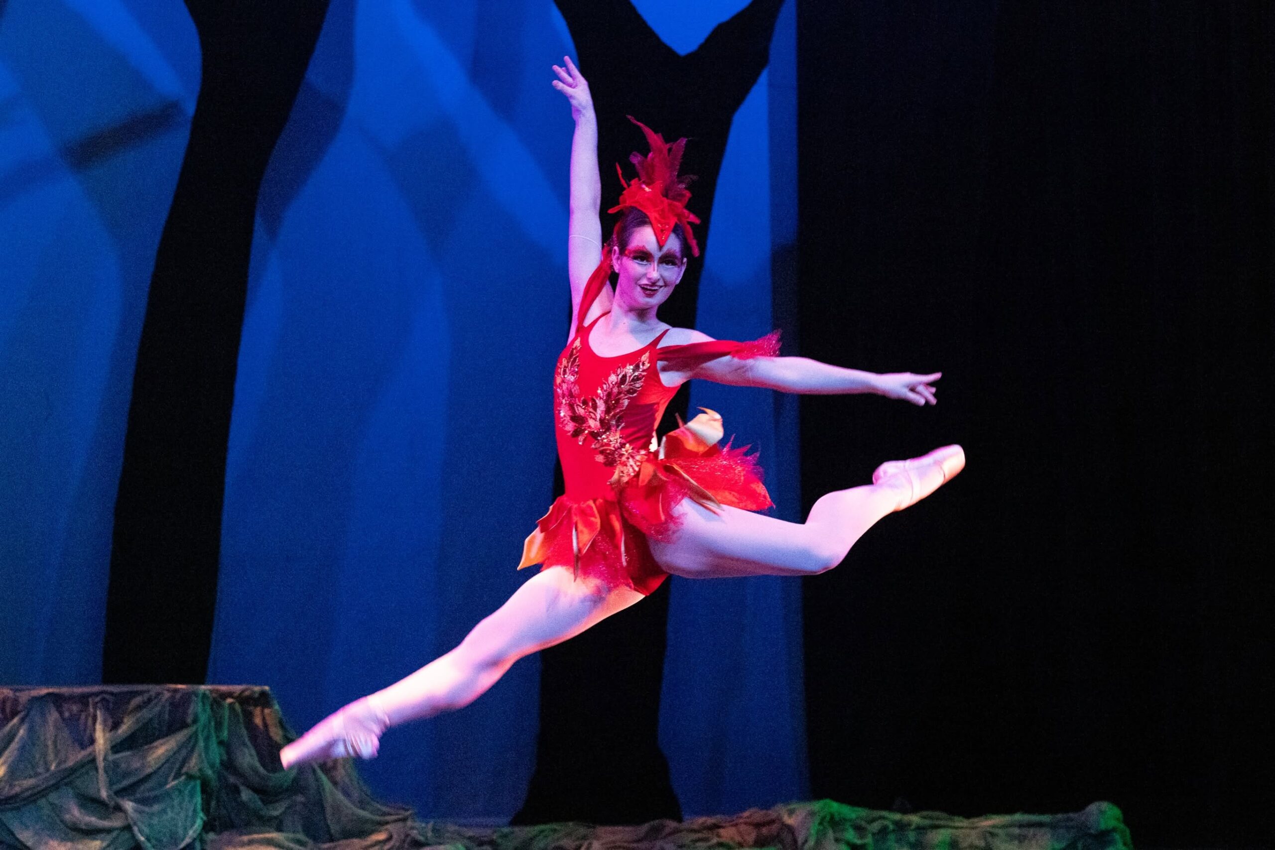 Dancer in red leaping